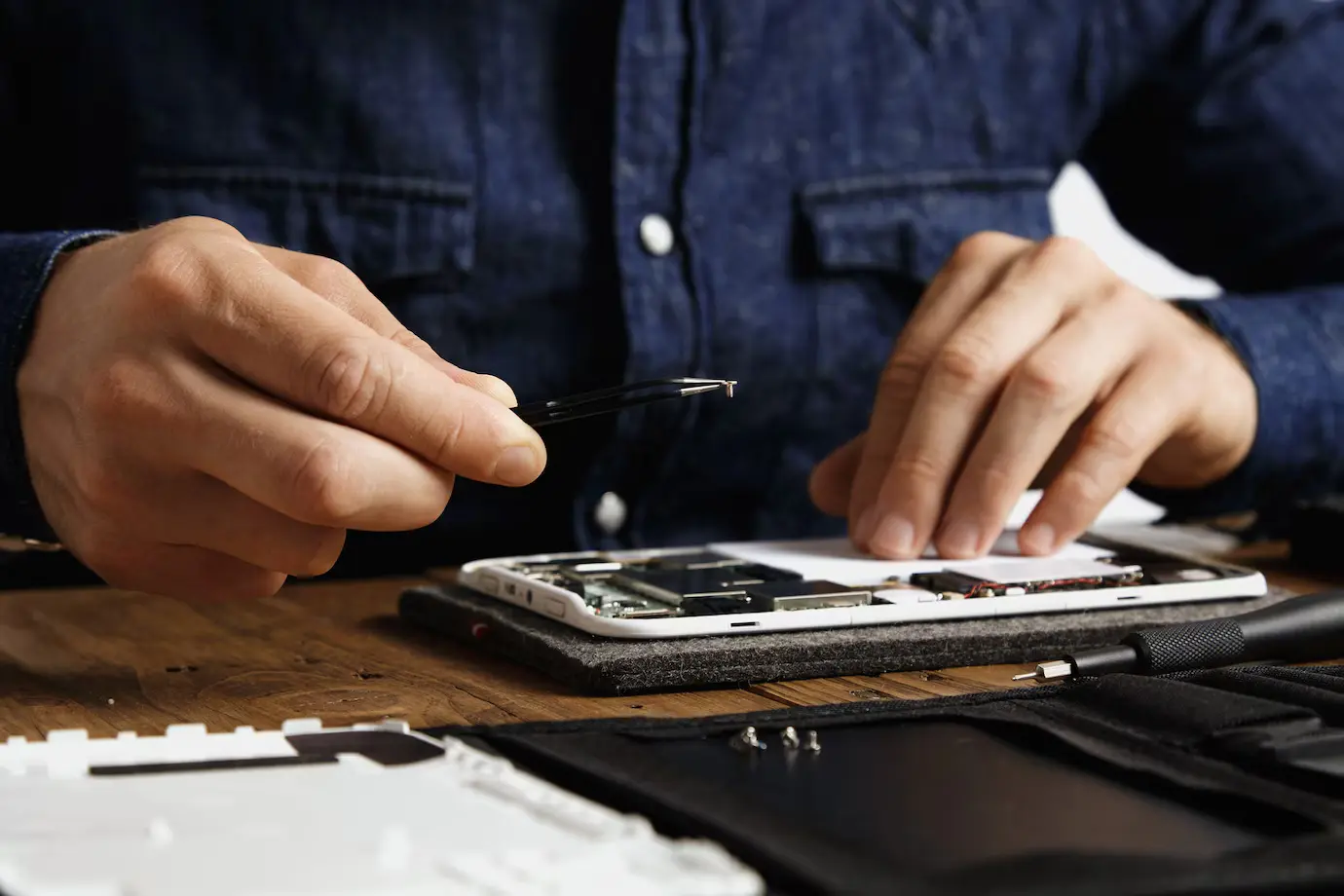 Close-up of precision smartphone repair work